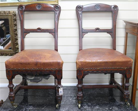 A pair of oak gothic side chairs by Holland & Sons, similar to the plain standard pattern designed by Pugin